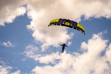 Paraglider flies in the sky.