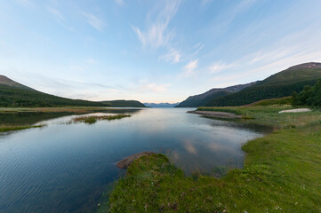 Fototapeta na wymiar A river leading out to the sea in northern Norway