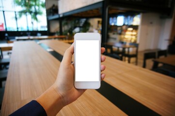 Close up of women's hands holding cell telephone blank copy space screen. smart phone with technology concept