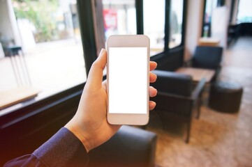 Close up of women's hands holding cell telephone blank copy space screen. smart phone with technology concept
