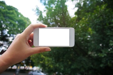 Close up of women's hands holding cell telephone blank copy space screen. smart phone with technology concept.