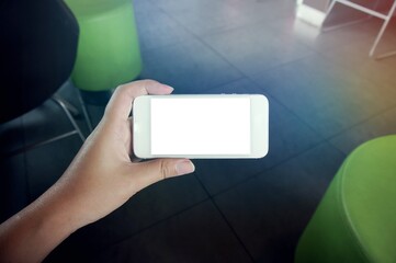 Close up of women's hands holding cell telephone blank copy space screen. smart phone with technology concept.