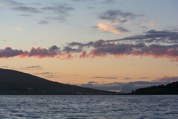 Fototapeta premium Clouds over a fjord in northern Norway