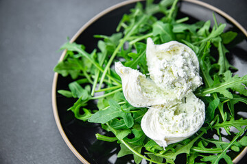 buratta salad green leaves arugula cheese burratina healthy meal food snack on the table copy space food background rustic top view