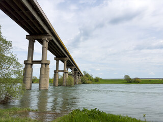 A long bridge over the river connects the two banks