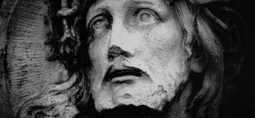 Jesus Christ. Fragment of an ancient statue. Black and white image.