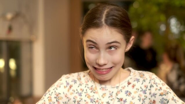 Portrait of a beautiful girl making different grimaces