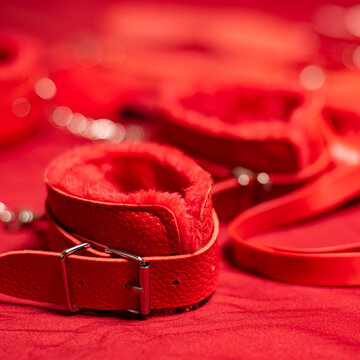 Red Bondage Gear on Red Satin Sheets, Shallow Focus