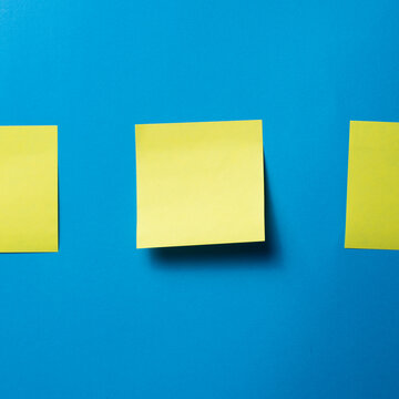 Blank Sticky Notes on Blue Background