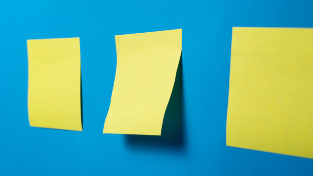 Blank Sticky Notes on Blue Background