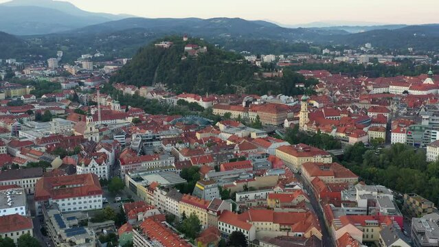 Graz Cityscape in Austria. Graz is the capital city of the southern Austrian province of Styria. At its heart is Hauptplatz, the medieval old town&rsquo;s main square. Beautiful Sunset Light. Drone, 4k.
