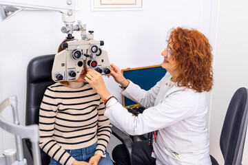 Optician and optometrist. Eye doctor and patient at the eye doctor's office