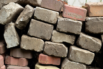 A pile of used multi-colored paving slabs.