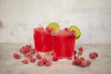 Raspberry cocktail with frozen raspberries