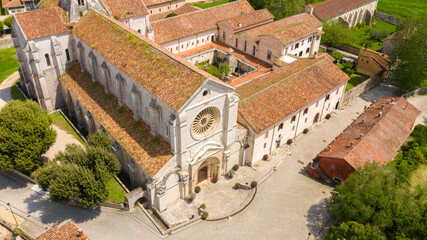 Aerial view of Fossanova Abbey located in Priverno, in the province of Latina, Italy. The church is a national monument and a perfect example of the transition from Romanesque to Italian Gothic.