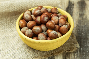 Mixed nuts in shell in a bowl, close-up