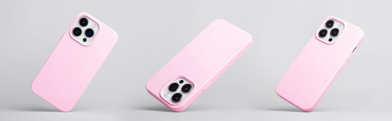 set of three iPhone 13 Pro and 14 in pink silicone case falling down in different angles, back view...