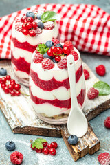 Scottish dessert whipped cream, roasted oatmeal and raspberries in jar. banner, menu, recipe place for text, top view