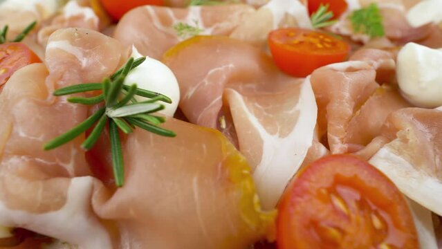 Seasoned raw ham. Traditional Prosciutto Toscano, dry cured slices of pork dried ham