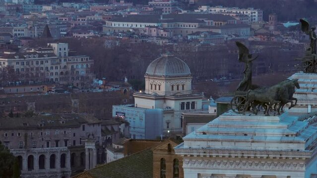 Aerial city view of Rome, Italy with Altare della Patria in foreground and the Great Synagogue in background. Old buildings and urban landscape of Italian city seen from drone flying in sky
