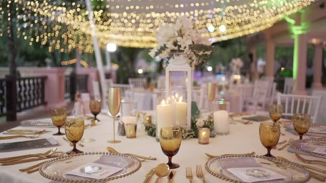 Festive decor flower glasses celebrate wedding dinner.