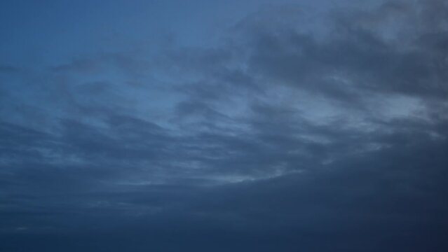Time-lapse of cloudy morning sky as background.