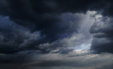 storm sky, dark dramatic clouds during thunderstorm, rain and wind, extreme weather, abstract background