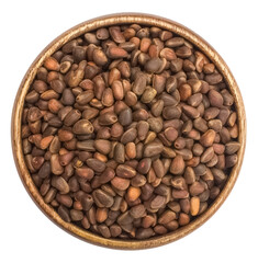 Pine nuts in a wooden plate on a transparent background. isolated object. View, top