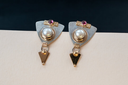 Beautiful unusual earrings close up, gemstone jewelry concept, promotional photo for an online jewelry store	