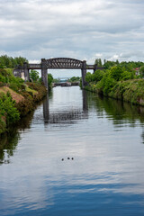 Fototapeta na wymiar Knutsford Road swing bridge crossing the Manchester Ship Canal in Warrington UK