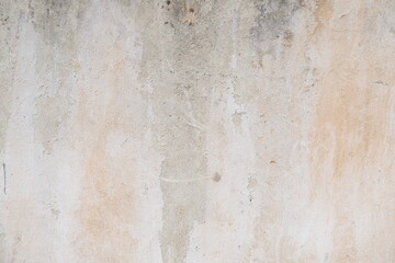 Concrete wall texture with cracks and scratches. Yellow and grey graphic materials	