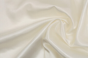 Fototapeta na wymiar Beige white pearl wave silk fabric. Abstract texture horizontal copy space background.