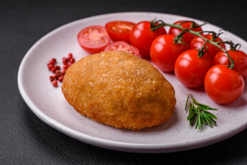Delicious baked cutlet breaded with spices, salt and herbs