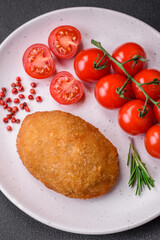 Delicious baked cutlet breaded with spices, salt and herbs