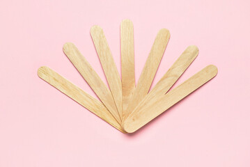 Ice cream sticks on pink background