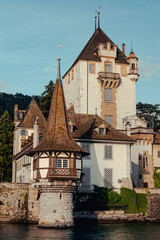 Fototapeta na wymiar Oberhofen Castle at Lake Thun Thunersee in swiss Alps, Switzerland. Schloss Oberhofen Bern Canton near Interlaken