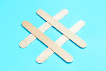 Composition with ice cream sticks on color background