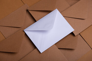 kraft and white paper envelopes close up, mockup