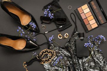 Composition with stylish female accessories, cosmetics, heels, clothes and gypsophila flowers on...