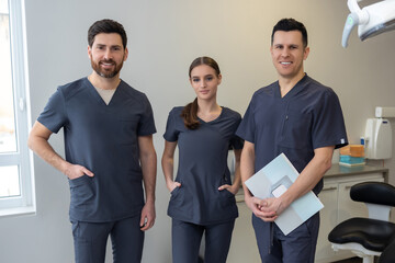 Team of dentists posing in dentistry