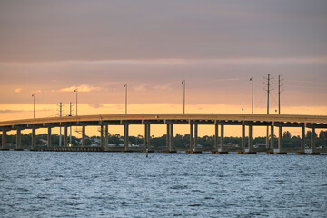Obraz premium Barron Collier Bridge and Gilchrist Bridge in Florida with moving traffic. Transportation infrastructure in Charlotte County connecting Punta Gorda and Port Charlotte over Peace River