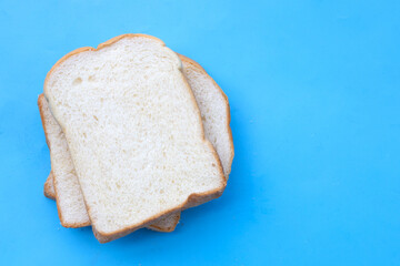 Sliced bread on blue background.