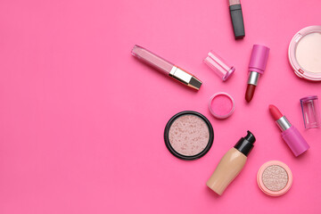 Obraz na płótnie Canvas Decorative cosmetics with lipsticks on pink background