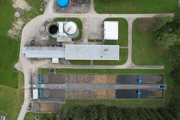 Aerial view of sewage treatment plant, filtration of polluted or waste water. Wastewater treatment...