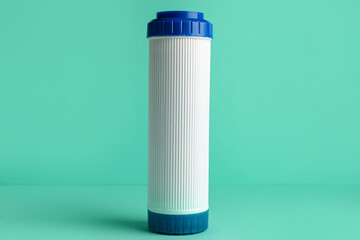 New water filter cartridge on green background