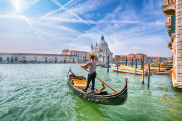 Breathtaking morning cityscape of Venice with famous Canal Grande and Basilica di Santa Maria della Salute church. © pilat666