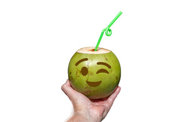 Green coconut with drawn emoji. tropical coconut water in selective focus. artistic photo