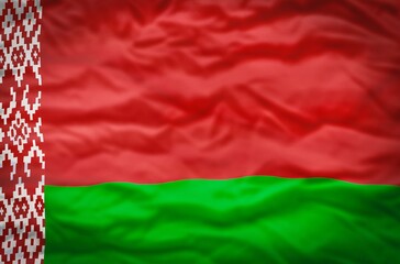 Belarus flag on a fabric wavy background. Wavy flag of Belarus fills the frame.