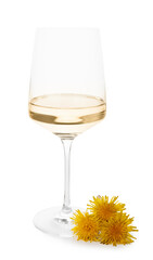 Glass of dandelion wine on white background