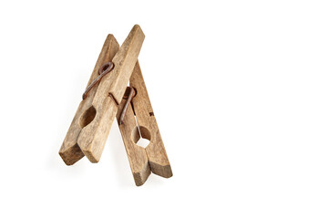 Two aged vintage wooden clothespin isolated on white background